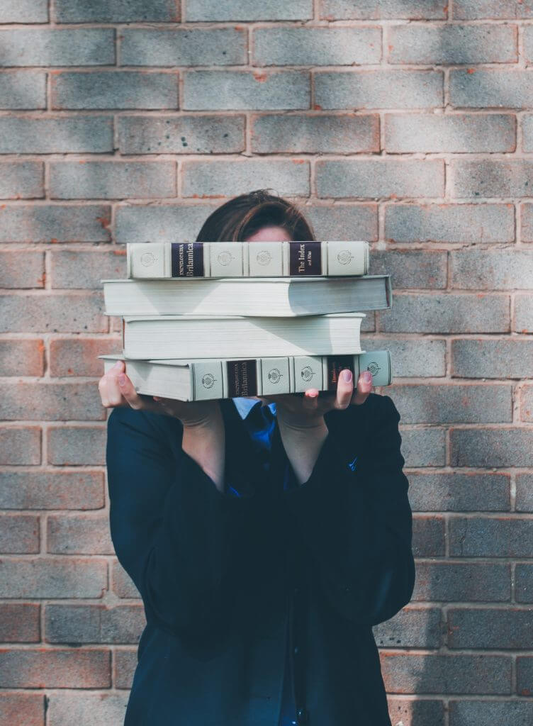 USA education 2021, girl holds books Siora Photography