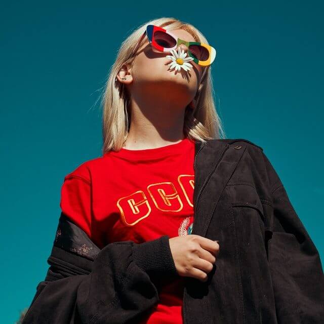 Image of a lady wearing colorful glasses used as an analogy for performance creatives 